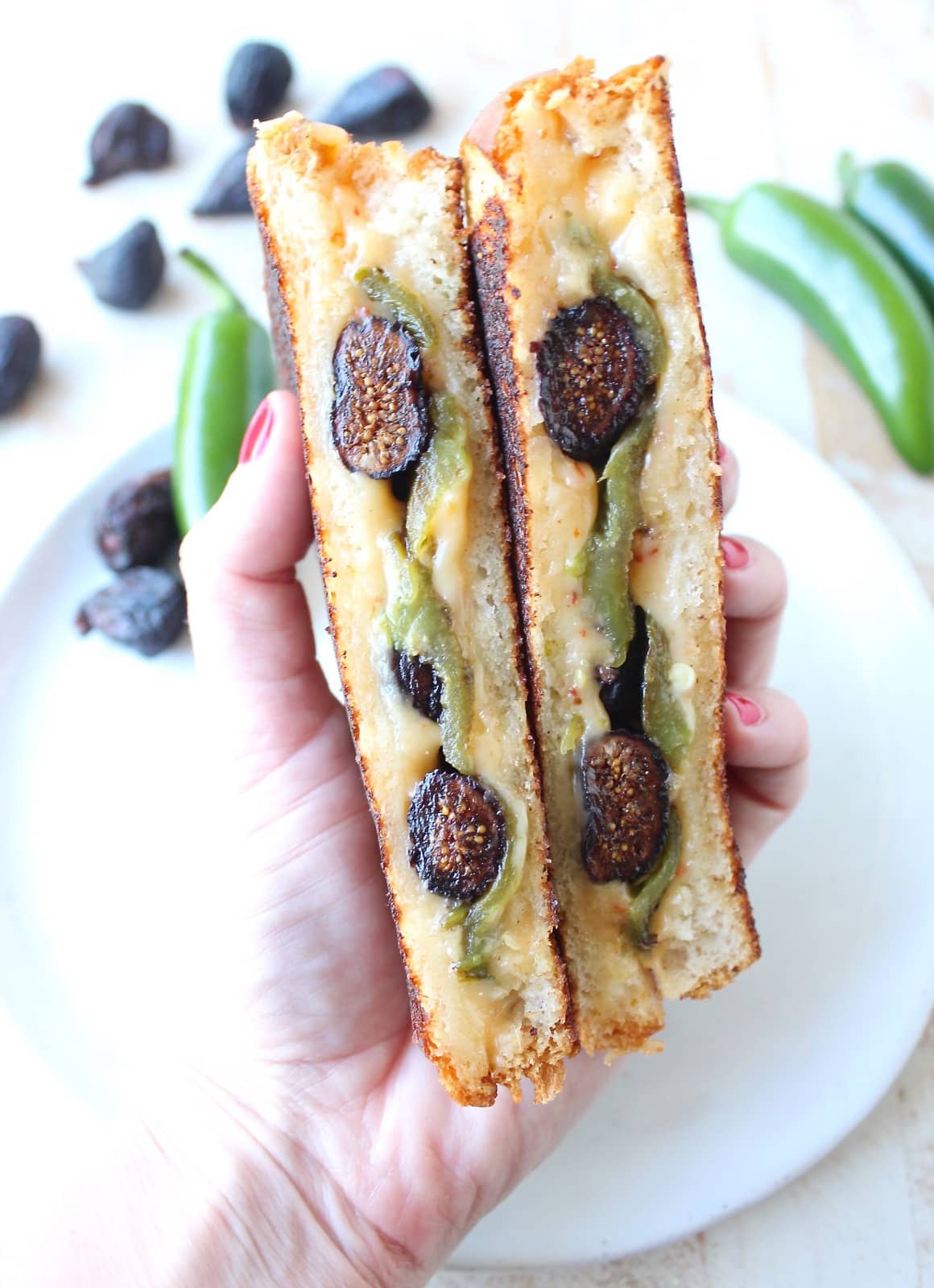 Roasted jalapeños, dried figs and spicy cheddar cheese are combined in this delicious, sweet and spicy, vegetarian jalapeno grilled cheese sandwich recipe!