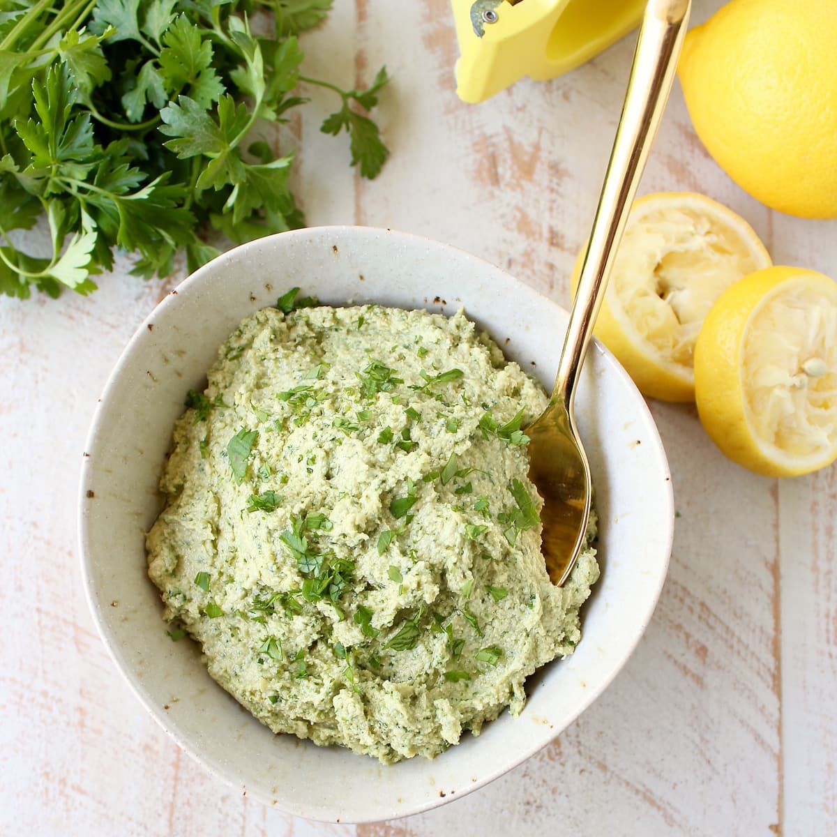 This healthy, vegan and gluten free Green Tahini Sauce Recipe is perfect for topping buddha bowls, chicken and fish, or serve it as a dip with veggies!
