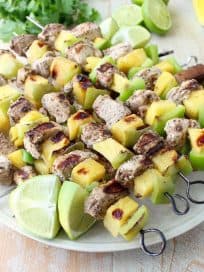 Jerk chicken kabobs with pineapple and bell peppers, the perfect 5-ingredient, gluten free recipe to toss on the grill and serve with honey lime sauce!