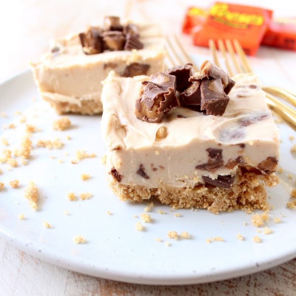 No bake cheesecake bars are a deliciously easy dessert, made with Reese's Peanut Butter Cups, they're filled with chocolate, peanut butter goodness!