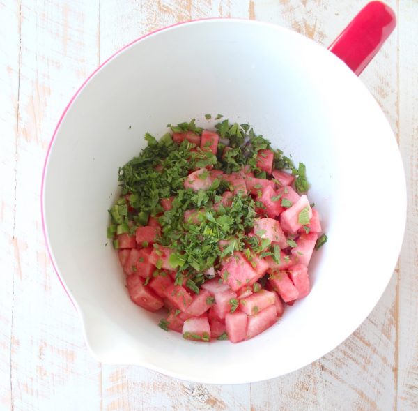 Watermelon salsa is refreshing, flavorful and will be the hit of the summer! Serve it with tortilla chips for a vegan and gluten free snack or serve it over chicken, fish or tacos for a delicious meal!