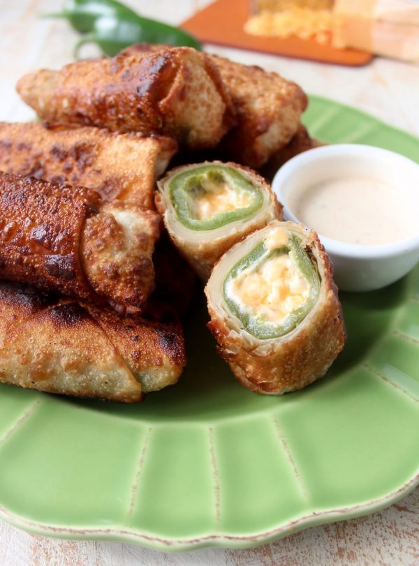 Crispy, cheesy, delicious jalapeno popper egg rolls are the perfect appetizer for parties or game day! They're also so easy to make in under 30 minutes!