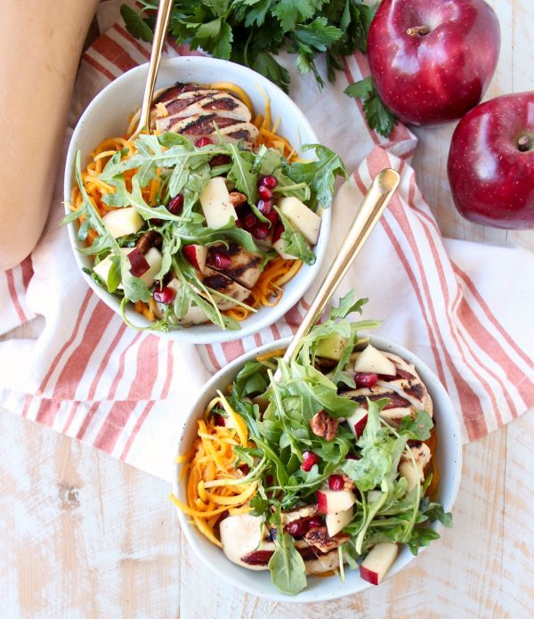 Grilled balsamic chicken & roasted butternut sqaush noodles are topped with a pomegranate apple arugula salad in this healthy, gluten free bowl recipe!