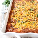Pumpkin enchiladas put a great fall spin on the traditional Mexican dish, made with a simple red pumpkin sauce & filled with chorizo, cheese or veggies!