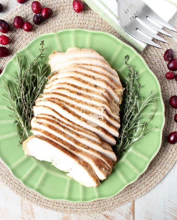 This simple slow cooker turkey breast recipe is perfect for Thanksgiving, or an easy weeknight dinner anytime! The maple apple glaze is delicious & only takes requires 4 ingredients & 5 minutes to prep!