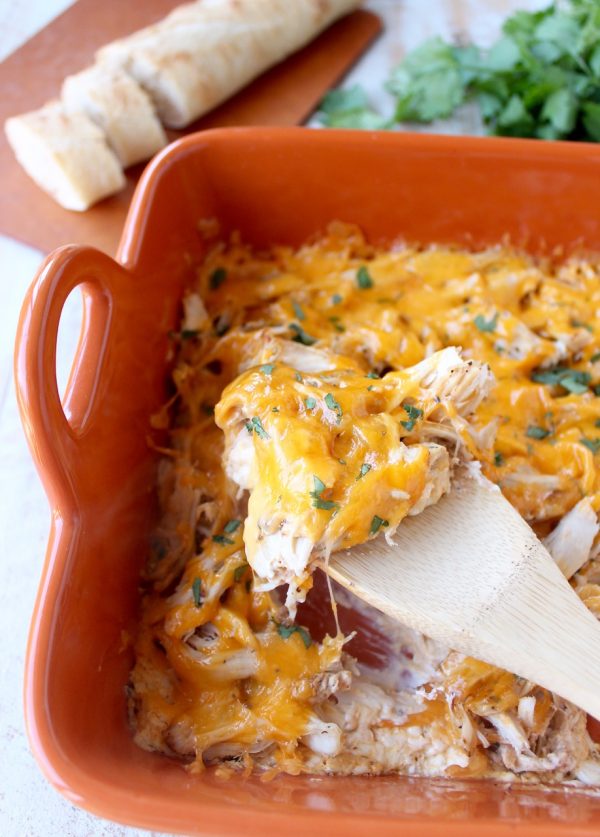 Shredded cajun turkey is placed on a layer of cajun ranch cream cheese and topped with cheddar cheese in this ultimate Cajun Turkey Cheese Dip recipe!