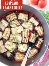 Overhead image of eggplant roll ups in skillet with serving spoon