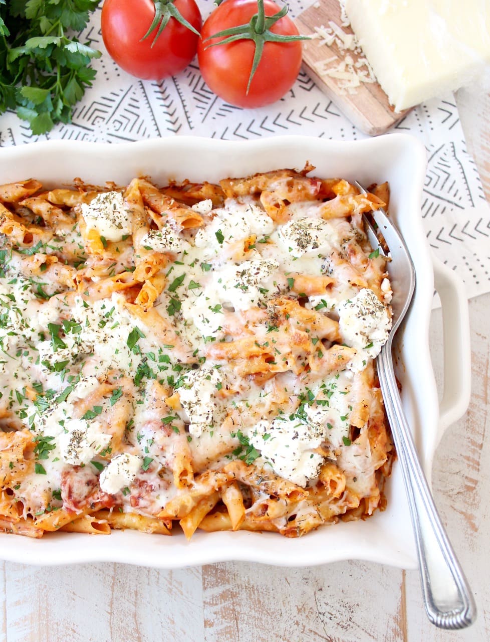 baked pasta in casserole dish with large serving fork