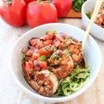 Delicious Italian marinated grilled shrimp is topped with homemade tomato basil bruschetta and served over sautéed zucchini noodles in this healthy, Whole 30 and gluten free Shrimp Bruschetta Zoodle Bowl recipe!