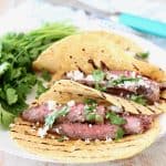Sliced Cajun Marinated Grilled Skirt Steak in Grilled Corn Tortillas with Cotija Cheese and Fresh Cilantro