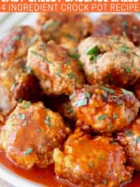 sausage balls stacked up on plate covered with buffalo sauce