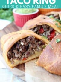Crescent roll wrapped ground beef taco ring on wood serving board
