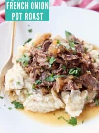 shredded pot roast with mashed potatoes on plate