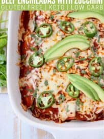 enchiladas in baking dish topped with sliced jalapenos and avocado