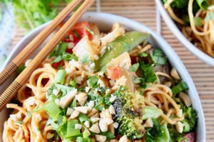 Thai peanut noodles in bowl with vegetables