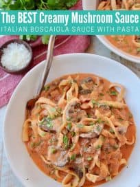 Overhead image of pasta in creamy tomato mushroom sauce in bowl