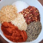 overhead image of spices in white bowl