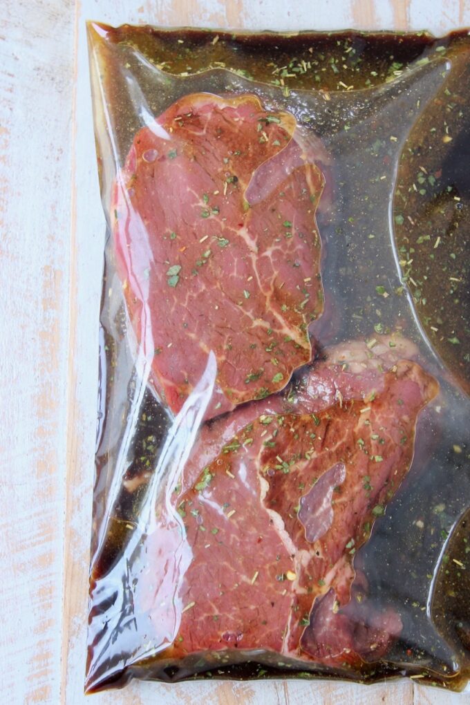 sirloin steaks in zipper bag of marinade
