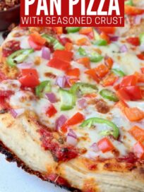 cooked pizza topped with veggies