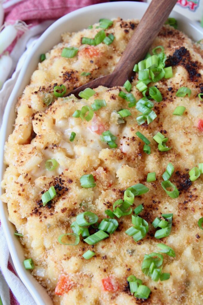 baked macaroni and cheese in dish with serving spoon