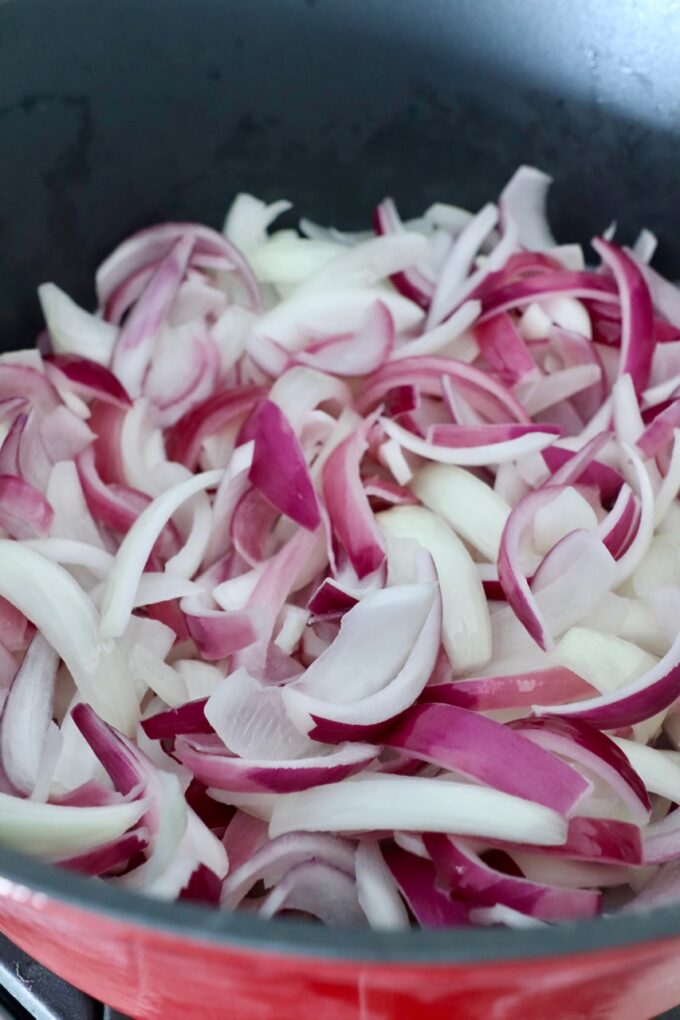 sliced onions in pot on stove