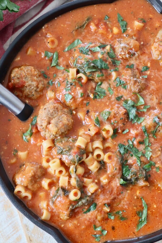 meatball soup in pan with spoon