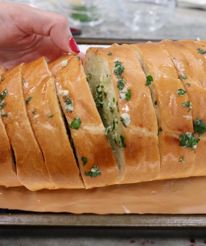 sliced bread filled with garlic herb butter