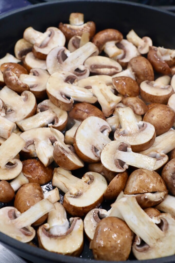 sliced mushrooms in skillet