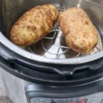 two cooked potatoes in Instant Pot