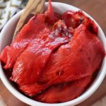 roasted red peppers in white bowl