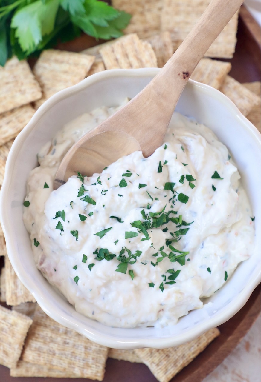 creamy garlic dip in bowl with spoon
