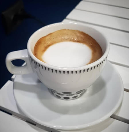 Espresso macchiato, served in a demitasse cup