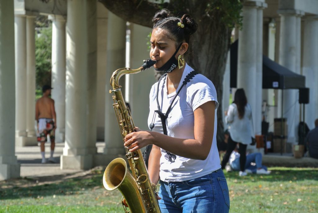 Tenor saxophonist Camille Collins plays by the Pillars at Lake Merritt.