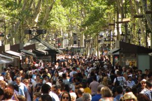 La Rambla, Barcelona, where tourists and locals alike crowd the scenic street. In Spain, foreign language classes start in kindergarten.
