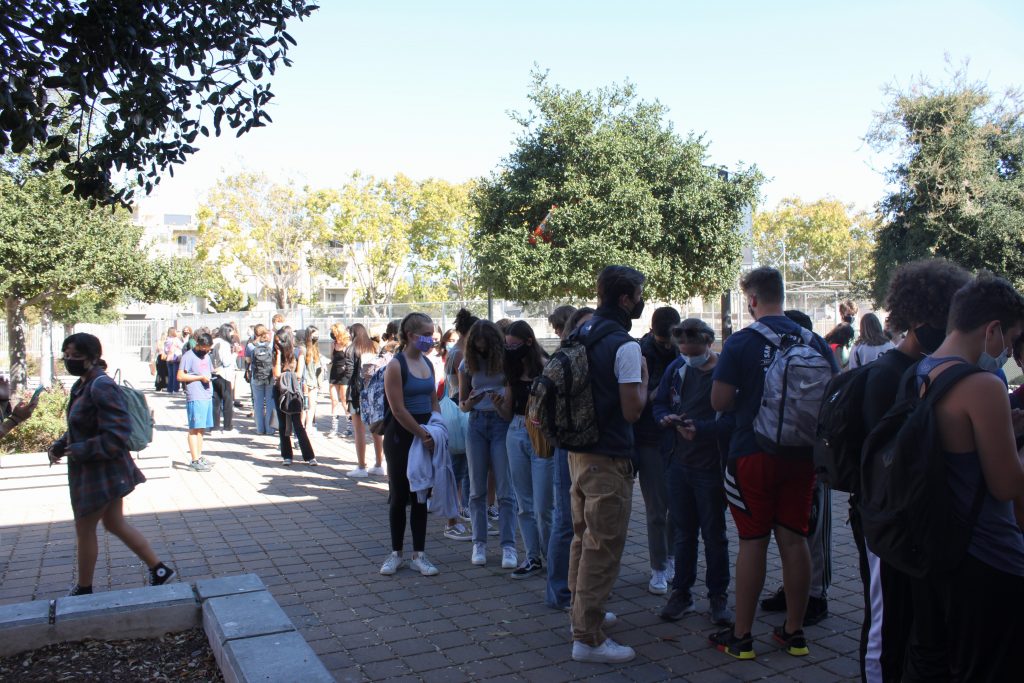 Students wait in line for afterschool COVID-19 testing. 