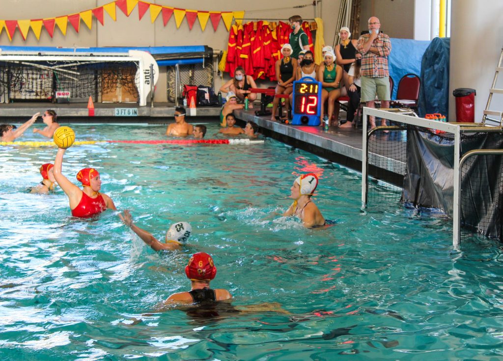 The BHS girls waterpolo team plays against San Marin without masks.