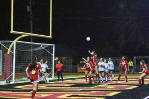 Luisa Bertolli heads the ball into the goal during the Nov. 30 home opener.