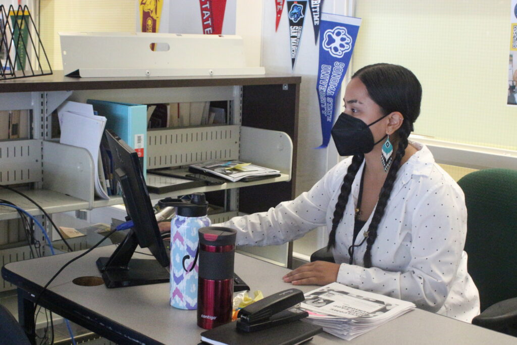 College counselor Maya Martinez works at her computer, where students are free to drop by.