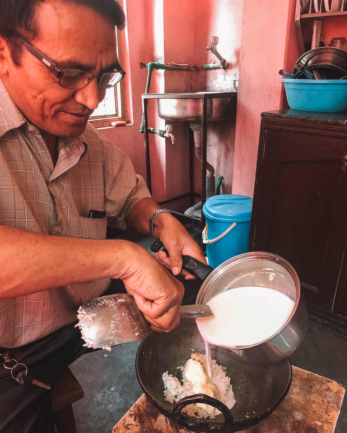 A man cooking food in Kathmandu.