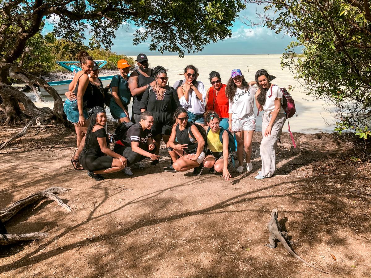 people on an island full of iguanas