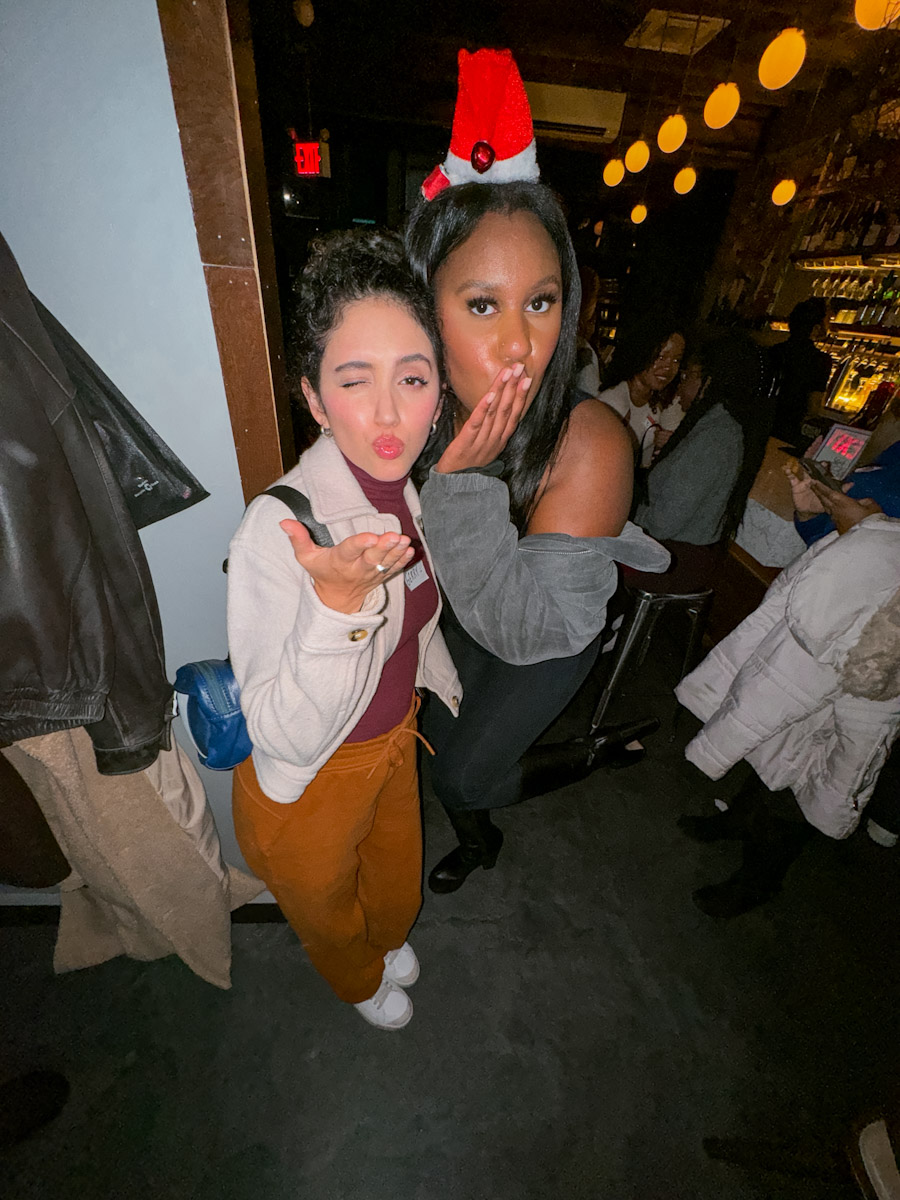 Two women in a bar in NYC making friends