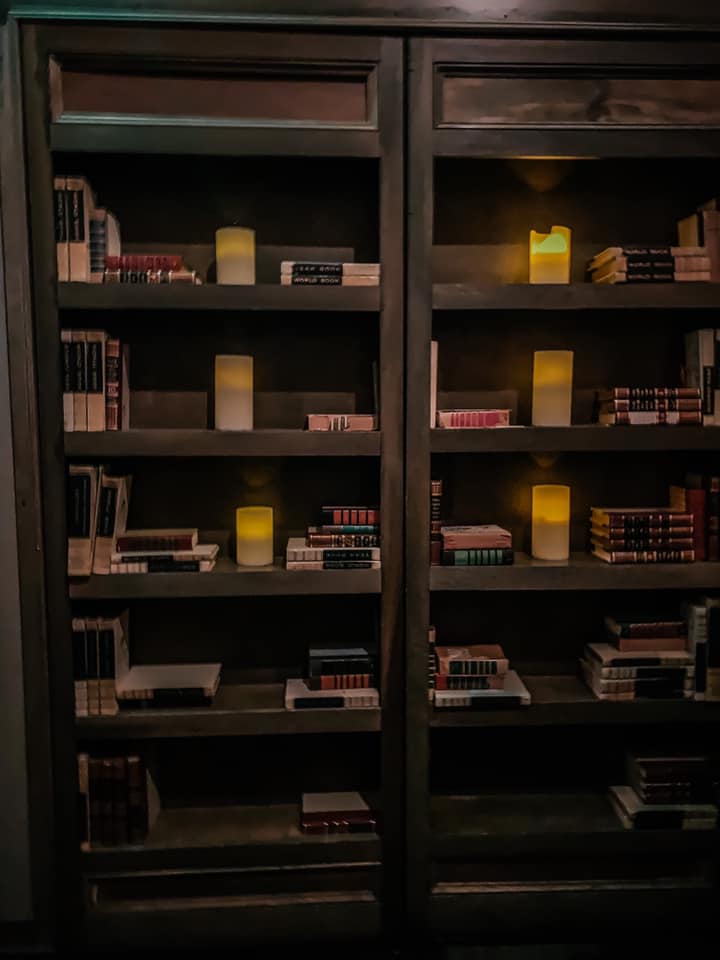 book shelves that double as a secret door into a speakeasy in downtown raleigh