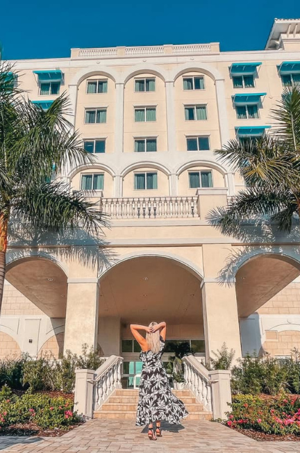 Woman posing outside of The Karol Hotel in Clearwater
