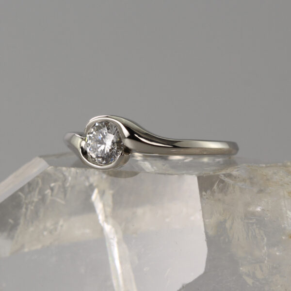 Recycled Platinum Diamond Solitaire Crossover Engagement Ring