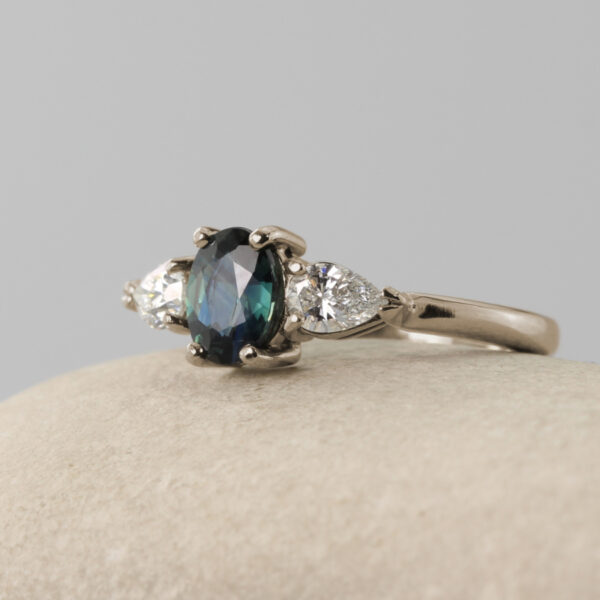 Recycled 18ct White Gold Teal Sapphire Trilogy Engagement Ring