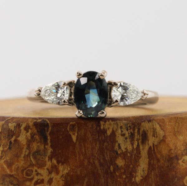 Unique 18ct White Gold Teal Sapphire Trilogy Engagement Ring
