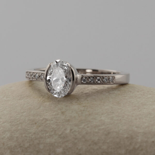 Bespoke Platinum Oval Solitaire Engagement Ring with Pave Shoulders