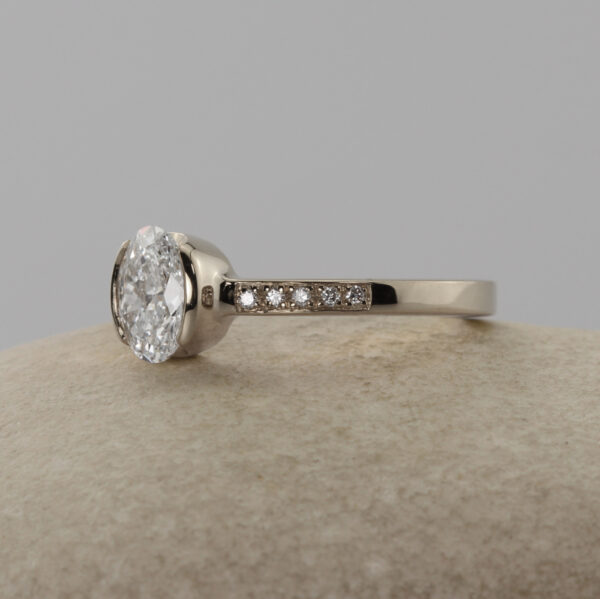 Unique 18ct White Gold Oval Solitaire Engagement Ring with Pave Shoulders