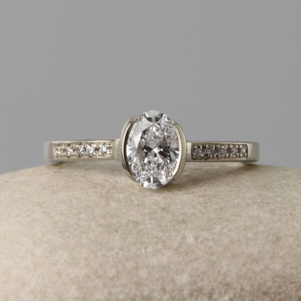 Sustainable 18ct White Gold Oval Solitaire Engagement Ring with Pave Shoulders