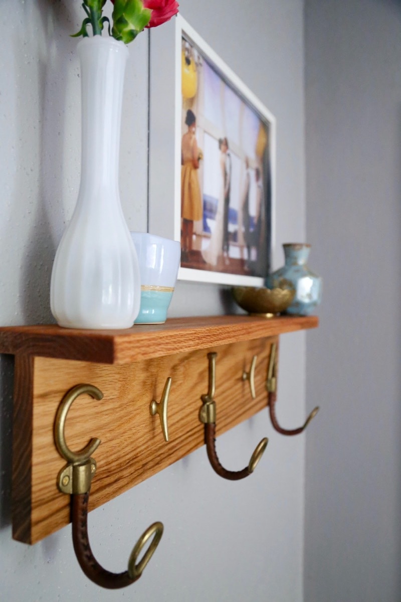 I love this entryway - it's beautiful! This DIY coat rack is so cute! It's such an easy project to put together, and it makes a huge difference in how the whole entryway looks. 